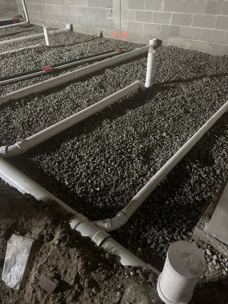 Below-slab plumbing rough-in at Raymond James Stadium