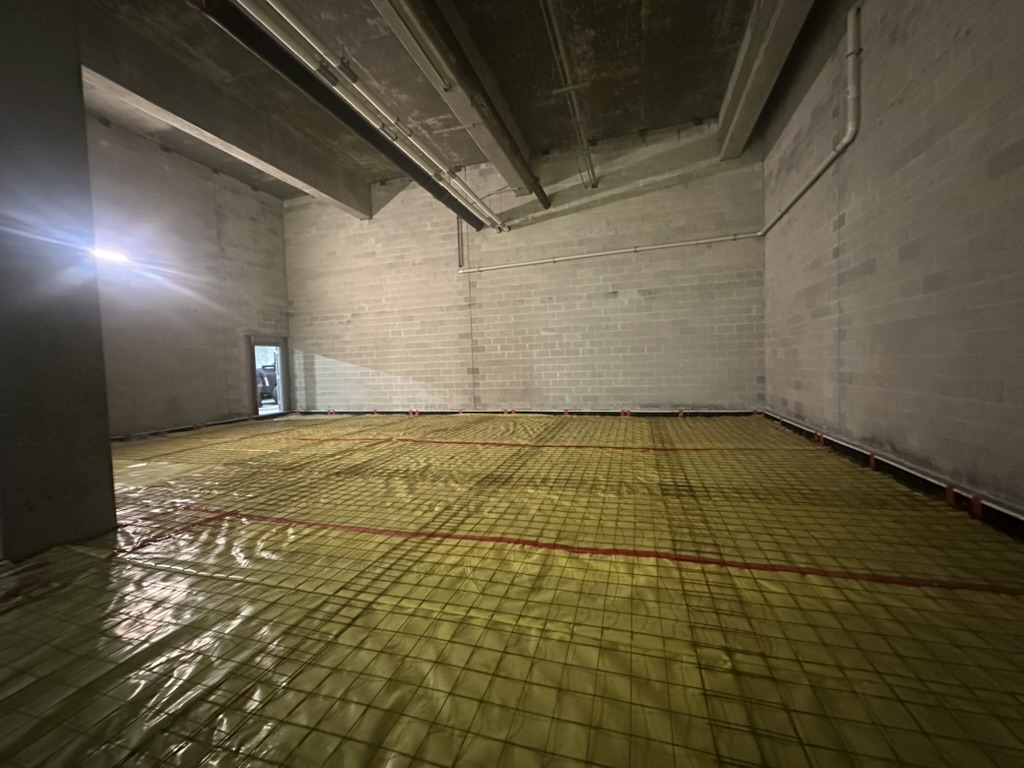 Slab reinforcement and vapor barrier installation at Raymond James Stadium