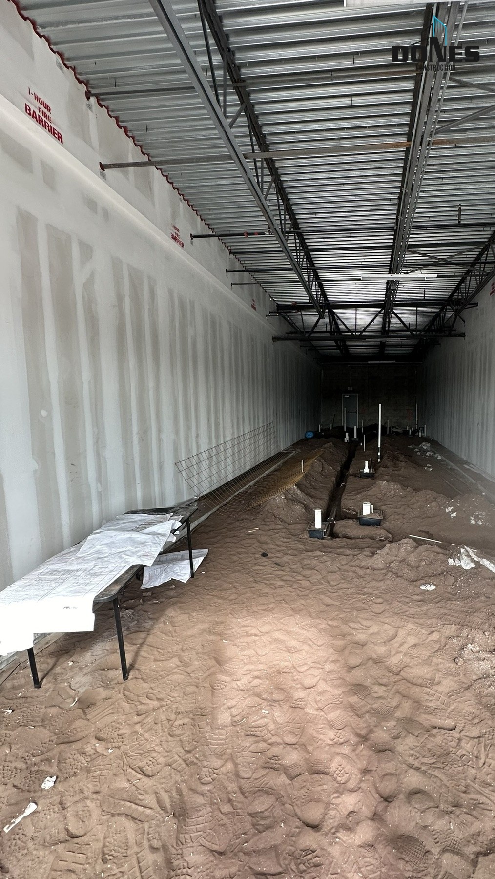 Raw Wing Snob tenant space with below-slab plumbing trenches