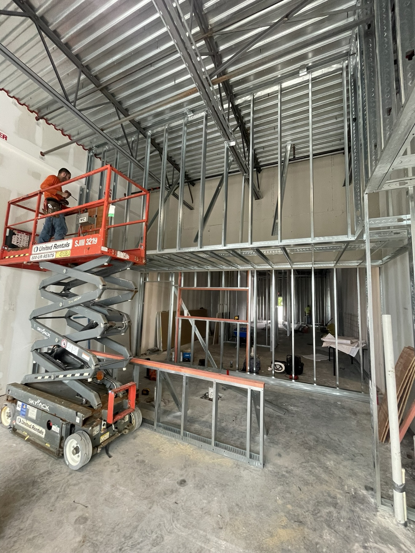 Steel framing during the Wing Snob commercial build-out in Riverview, Florida