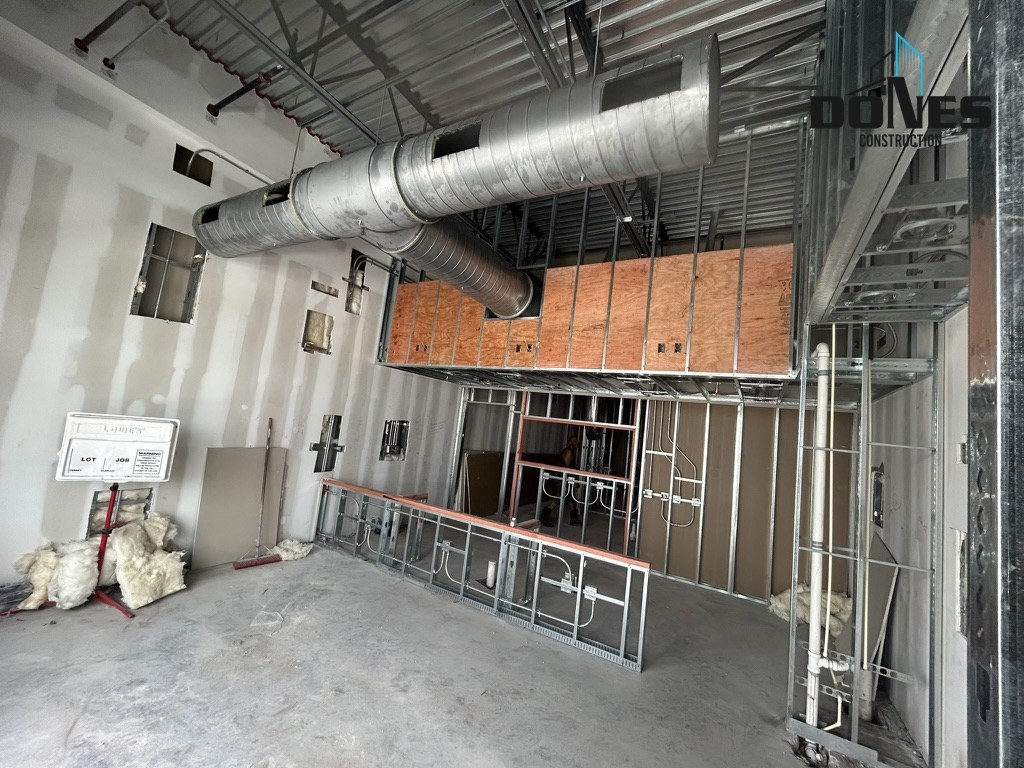HVAC ductwork, utilities and framing inside the Wing Snob kitchen