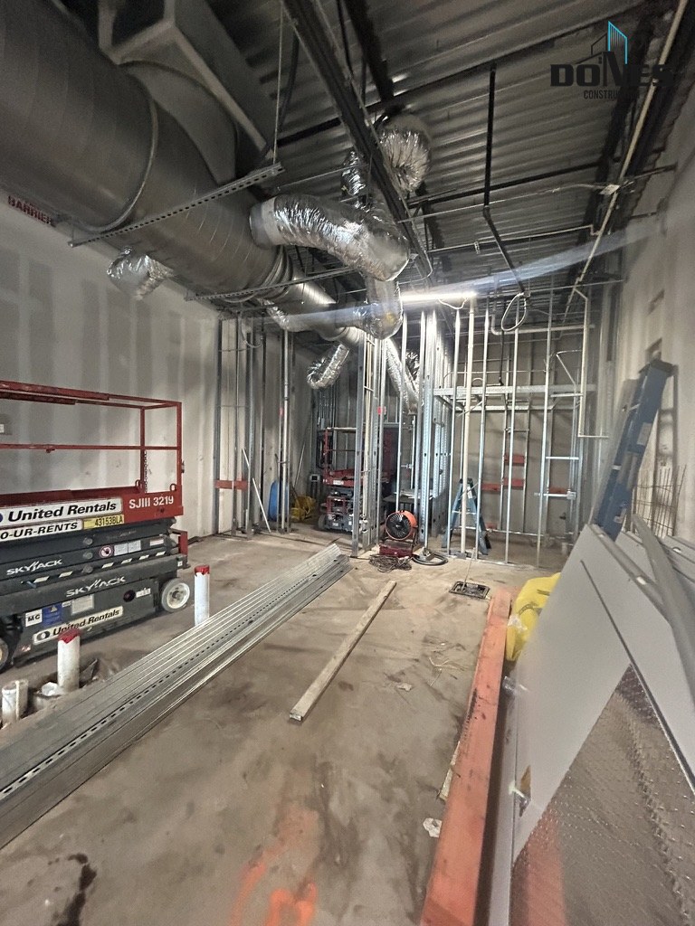 Overhead ductwork and framed rooms in the Wing Snob restaurant